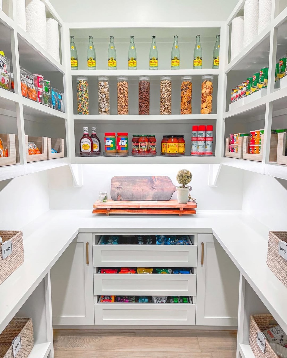White walk-in pantry with pull-out drawers and organized snack storage, Great Neck Long Island