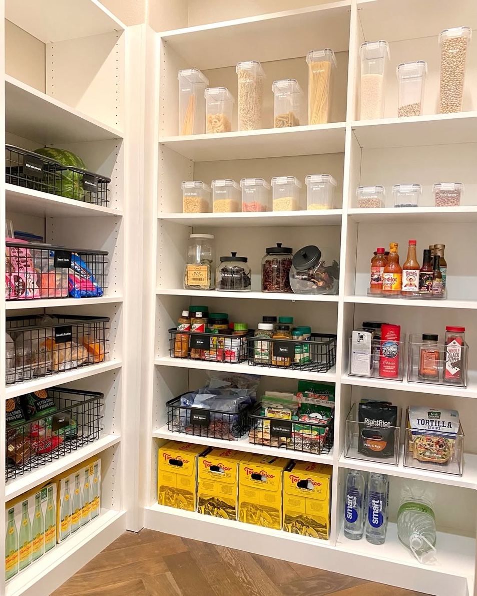White corner pantry with organized spices and wire baskets, Manhasset Long Island